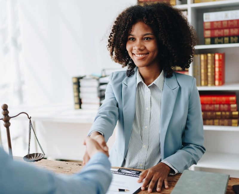 Law, consultation, agreement, contract, lawyer or attorney shakes hands to agree on the client's of